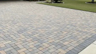 Expert interlocking paver driveway installation in Houston, TX showcasing clean design and quality craftsmanship