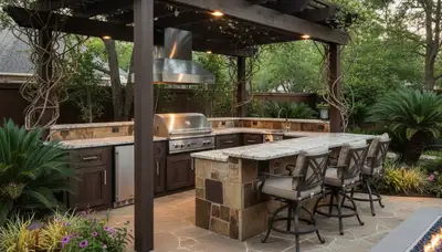 Luxury outdoor kitchen with pergola and native landscaping design in Houston, TX backyard